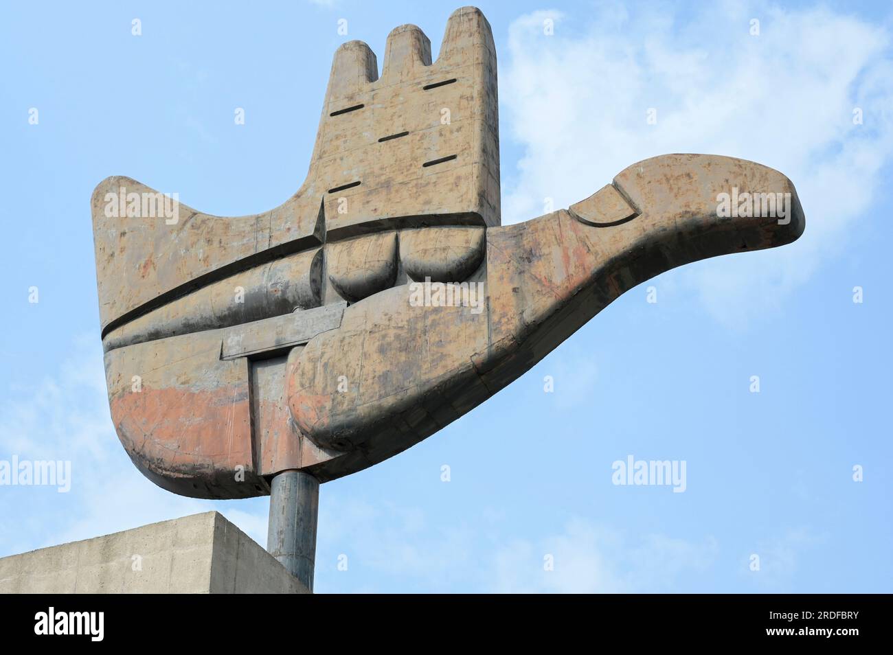 INDIA, Chandigarh, the master plan of the city divided in sectors was prepared by swiss-french architect Le Corbusier in the 1950` , Sector 1 Capitol complex, metal and concrete monument The Open Hand designed by Le Corbusier, symbolizes 'the hand to give and the hand to take; peace and prosperity, and the unity of mankind' Stock Photo